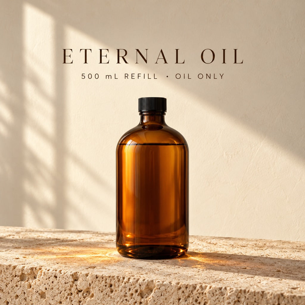 Azhara Eternal Oil 500 mL refill: amber glass bottle of clean-burning lamp oil on travertine. Oil only.