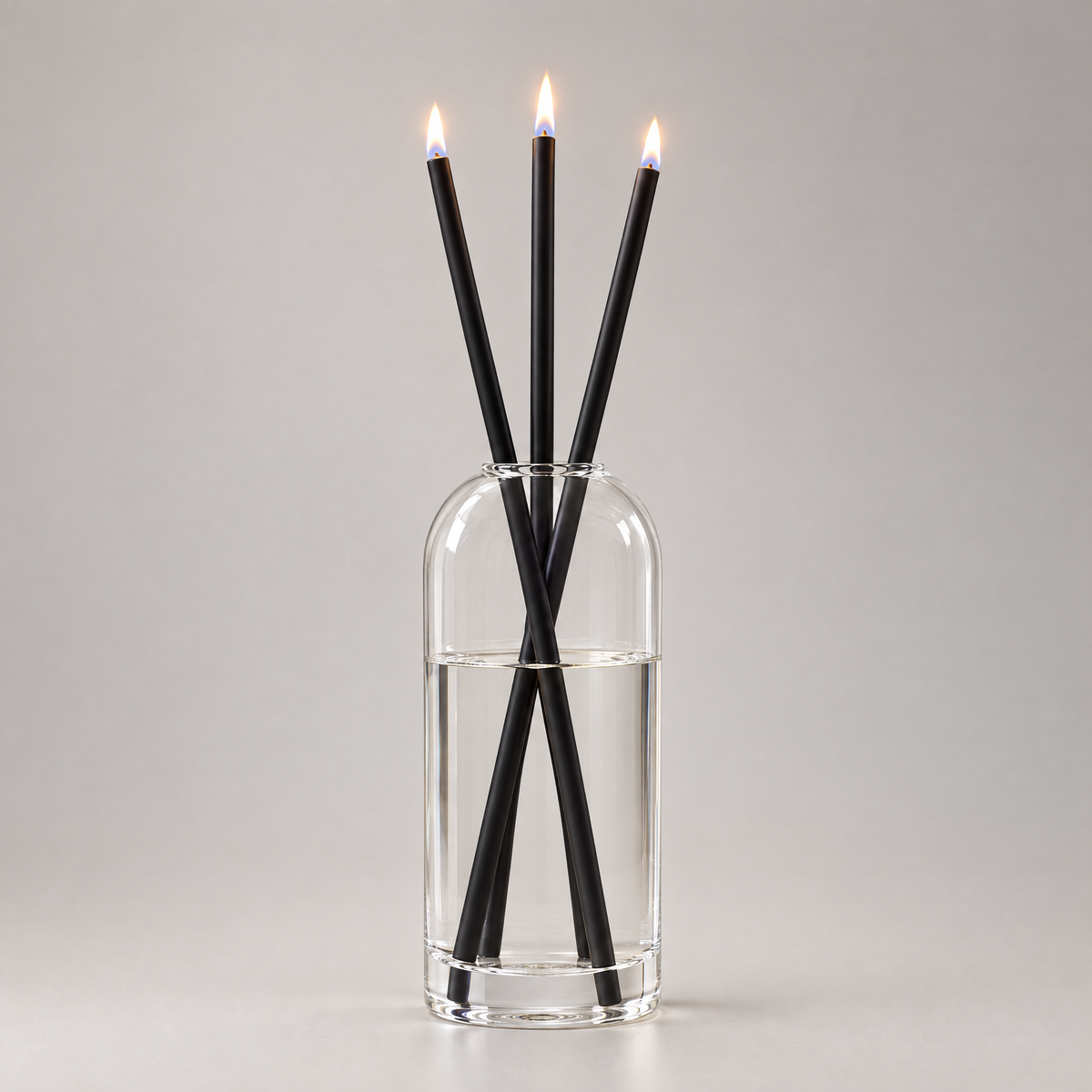 Azhara Eternal Candle Set in black - three lit refillable oil candles in a clear glass vase